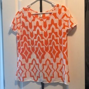 Orange and white patterned slit back top